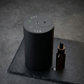 Siweiyi smart waterless car nebulizer, photorealistic dark-premium packshot